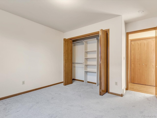 unfurnished bedroom with light carpet