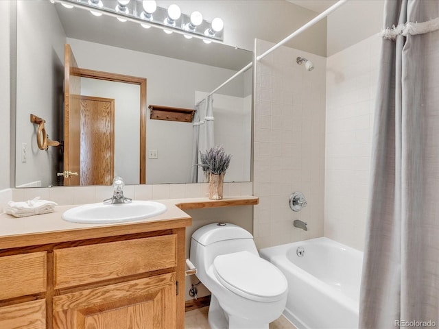 full bathroom with toilet, vanity, and shower / tub combo with curtain