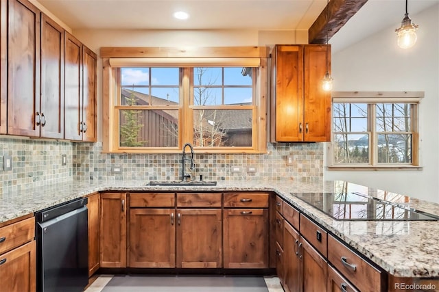52 Buckskin Ln, Silverthorne, CO 80498 - kitchen with dishwashing machine, tasteful backsplash, light stone countertops, brown cabinetry, and recessed lighting