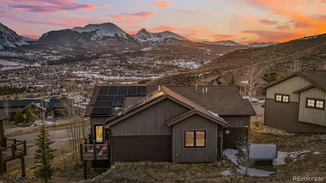52 Buckskin Ln, Silverthorne, CO 80498 - view of front of house with a mountain view and roof mounted solar panels