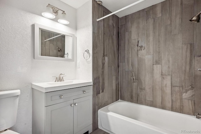 full bathroom featuring toilet, shower / bathing tub combination, and vanity