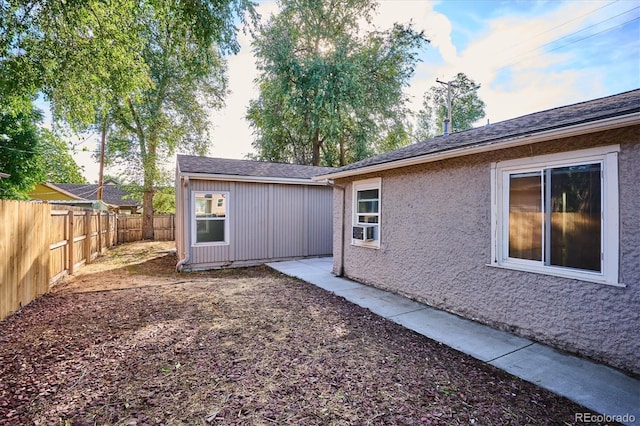 back of house featuring a fenced backyard