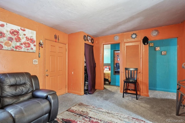 carpeted living room with baseboards