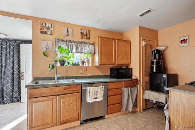 kitchen featuring light tile patterned floors, a sink, stainless steel dishwasher, visible vents, and black microwave