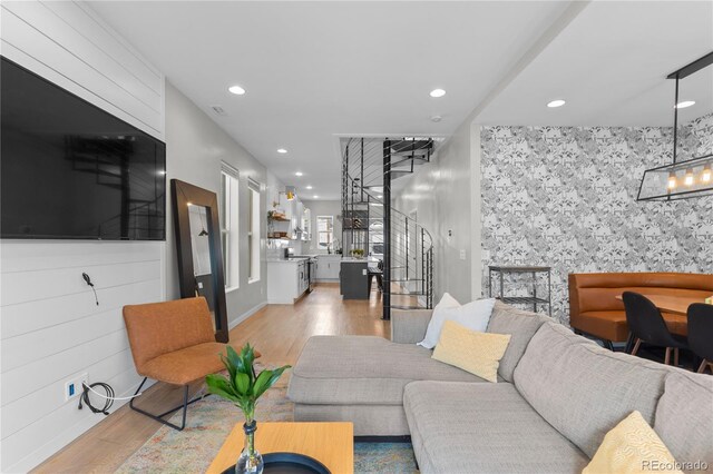 3443 Lawrence St, Denver, CO 80205 - living area with light wood-style flooring, recessed lighting, and stairs