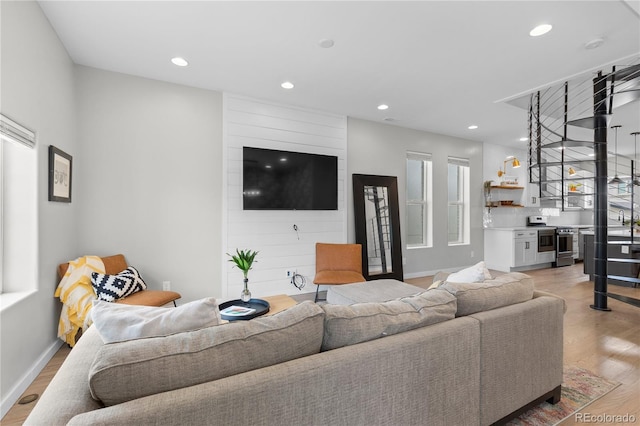 3443 Lawrence St, Denver, CO 80205 - living area featuring recessed lighting, light wood-type flooring, and healthy amount of natural light