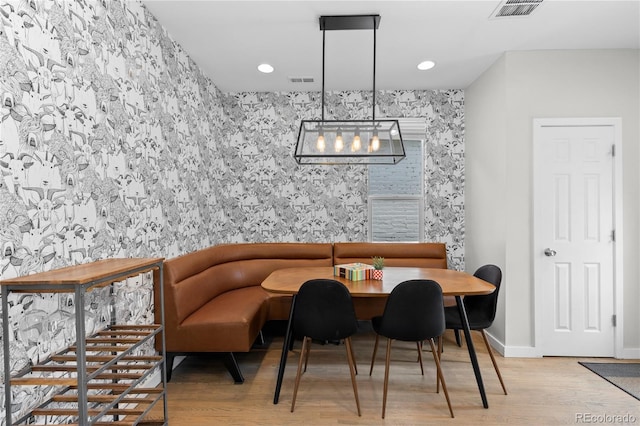 3443 Lawrence St, Denver, CO 80205 - dining room featuring wood finished floors, recessed lighting, and a chandelier