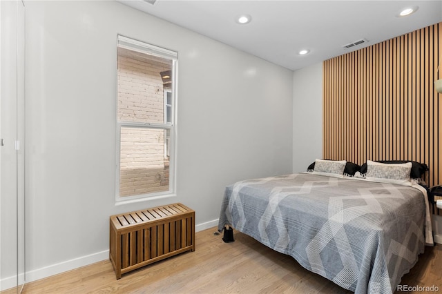 3443 Lawrence St, Denver, CO 80205 - bedroom featuring radiator, wood finished floors, and recessed lighting