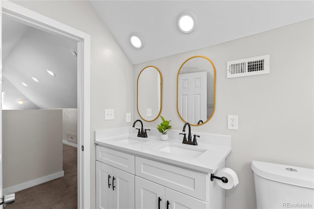 3443 Lawrence St, Denver, CO 80205 - bathroom with lofted ceiling and double vanity
