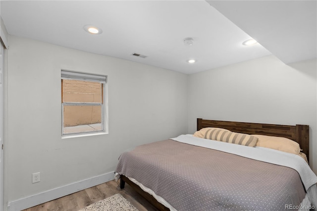 3443 Lawrence St, Denver, CO 80205 - bedroom with wood finished floors and recessed lighting