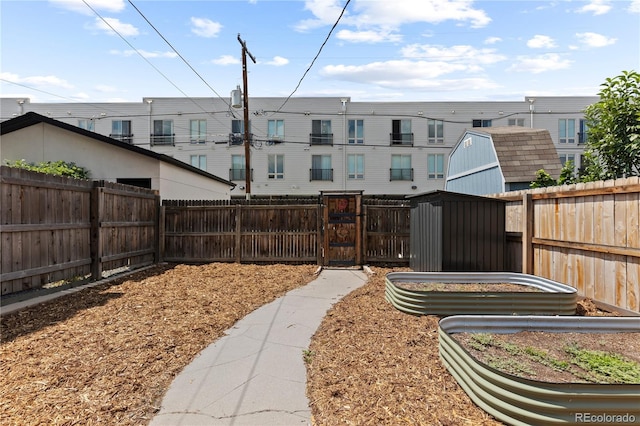 3443 Lawrence St, Denver, CO 80205 - fenced backyard with a gate and a garden