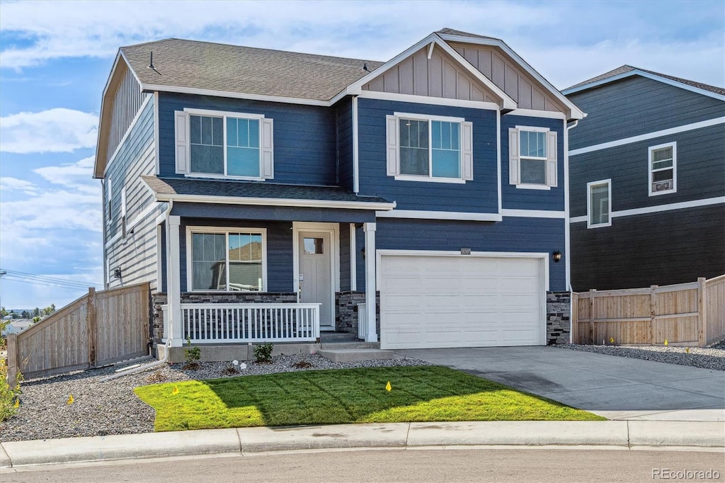 craftsman-style home featuring a garage and a porch