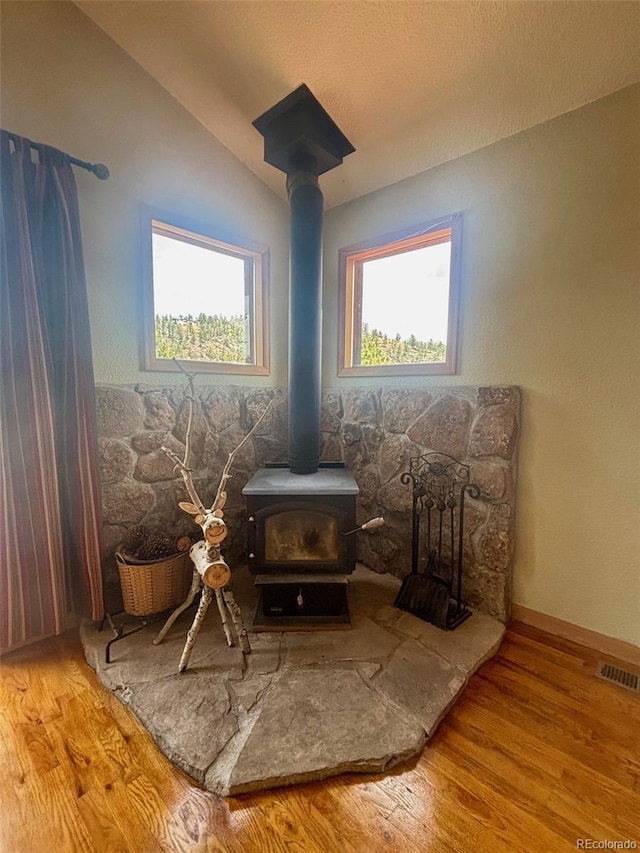 33508 Persistence Ave, Pine, CO 80470 - detailed view of a wood stove and wood finished floors
