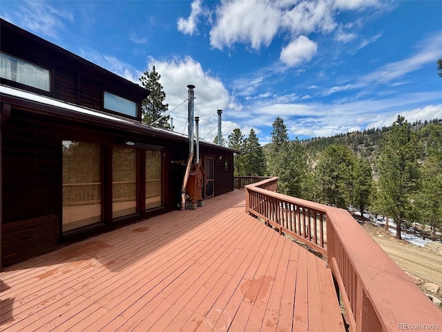 33508 Persistence Ave, Pine, CO 80470 - wooden deck featuring a view of trees