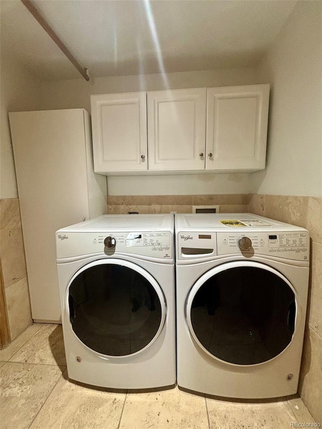 33508 Persistence Ave, Pine, CO 80470 - washroom featuring cabinet space and washer and clothes dryer