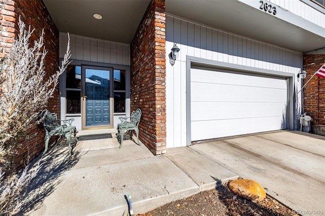 doorway to property featuring a garage