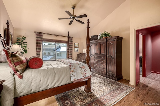 bedroom featuring access to exterior, vaulted ceiling, wood-type flooring, and ceiling fan