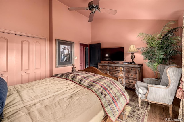 bedroom featuring ceiling fan, lofted ceiling, hardwood / wood-style floors, and a closet