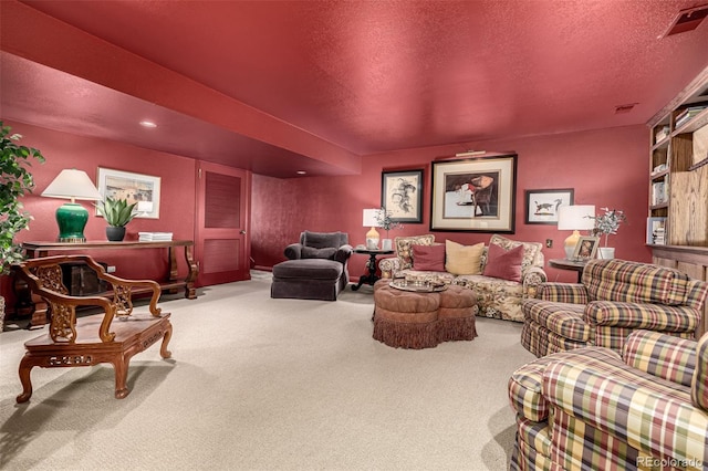 carpeted living room with a textured ceiling