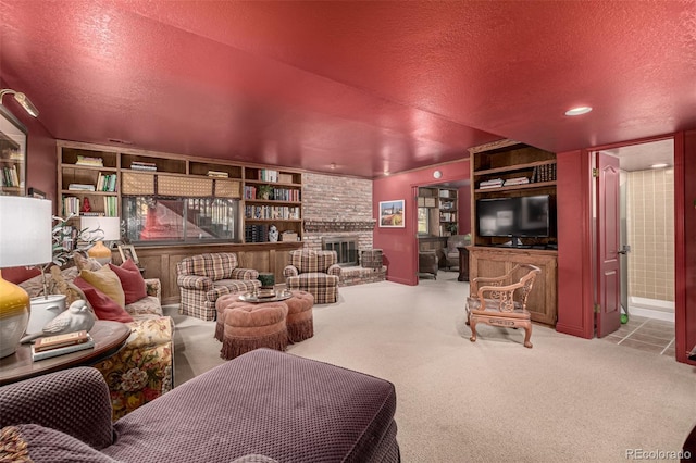 interior space with a fireplace, light colored carpet, and a textured ceiling