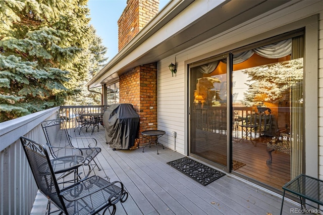 wooden deck with grilling area