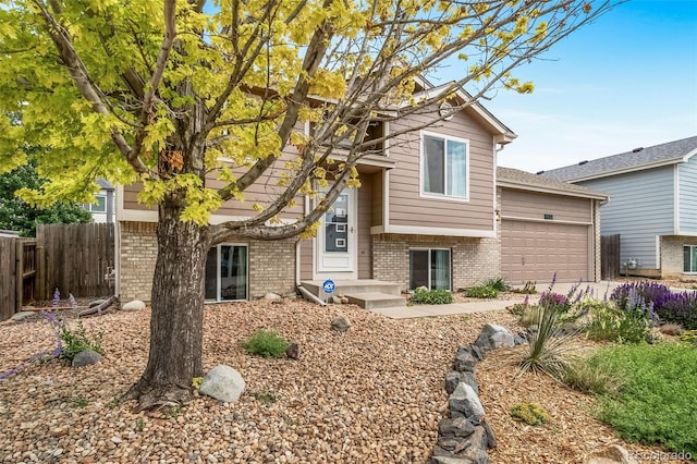 1482 S Pitkin Cir, Aurora, CO 80017 - tri-level home with brick siding and a garage