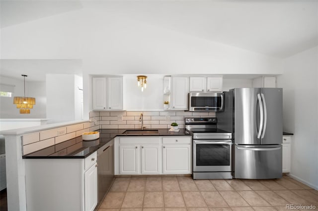 1482 S Pitkin Cir, Aurora, CO 80017 - kitchen featuring appliances with stainless steel finishes, dark countertops, a peninsula, high vaulted ceiling, and white cabinets