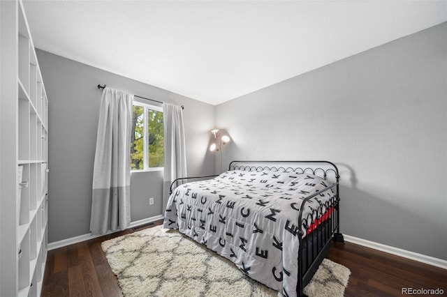 1482 S Pitkin Cir, Aurora, CO 80017 - bedroom featuring wood finished floors and baseboards
