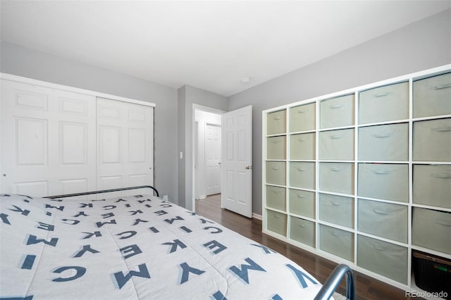 1482 S Pitkin Cir, Aurora, CO 80017 - unfurnished bedroom featuring dark wood-style floors and a closet