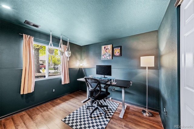 1482 S Pitkin Cir, Aurora, CO 80017 - home office featuring a textured ceiling, wood finished floors, and a textured wall