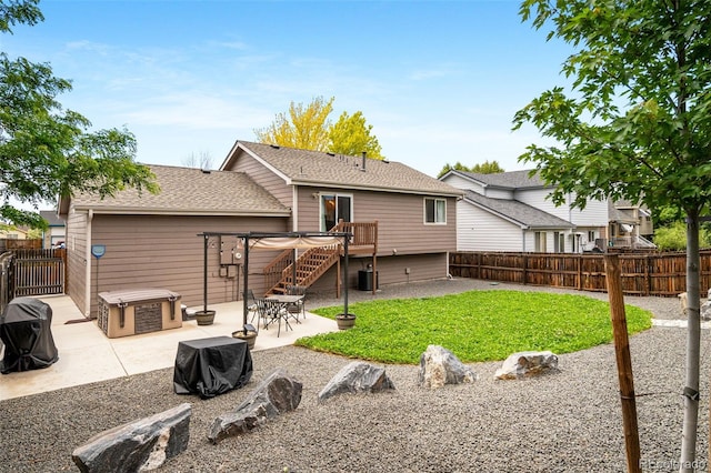 1482 S Pitkin Cir, Aurora, CO 80017 - back of property with a patio, a fenced backyard, and roof with shingles