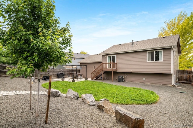 1482 S Pitkin Cir, Aurora, CO 80017 - back of house with a patio, a fenced backyard, a deck, stairway, and roof with shingles