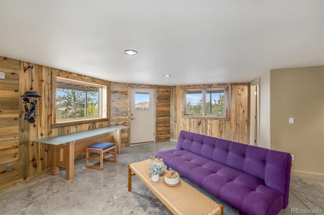 551 Spade Pl, Jefferson, CO 80456 - living room featuring unfinished concrete flooring and wood walls