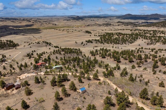 551 Spade Pl, Jefferson, CO 80456 - aerial view of property's location with a desert landscape, rural landscape, and a mountain backdrop