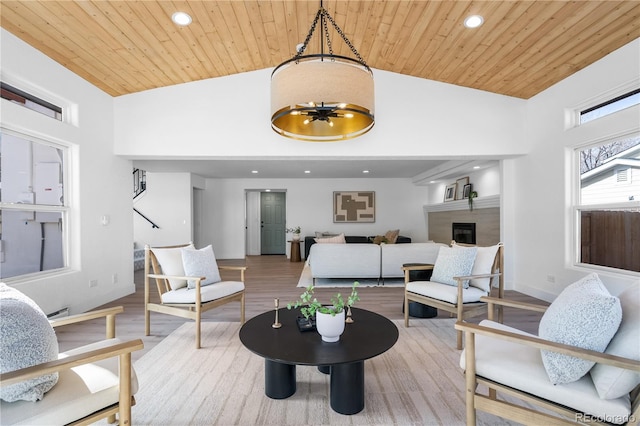 living room featuring high vaulted ceiling, hardwood / wood-style flooring, and wooden ceiling