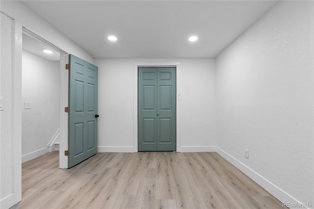 spare room with light hardwood / wood-style flooring