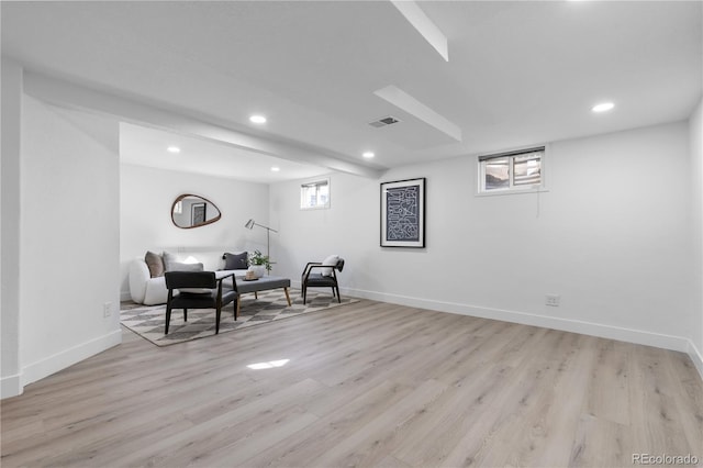 living area with light hardwood / wood-style flooring