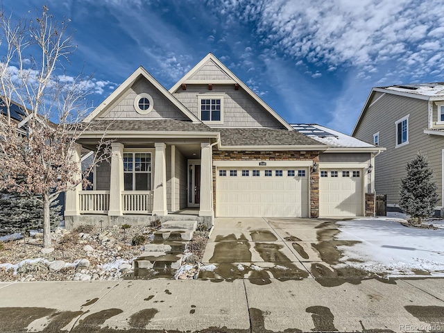 view of front of home with a porch and a garage