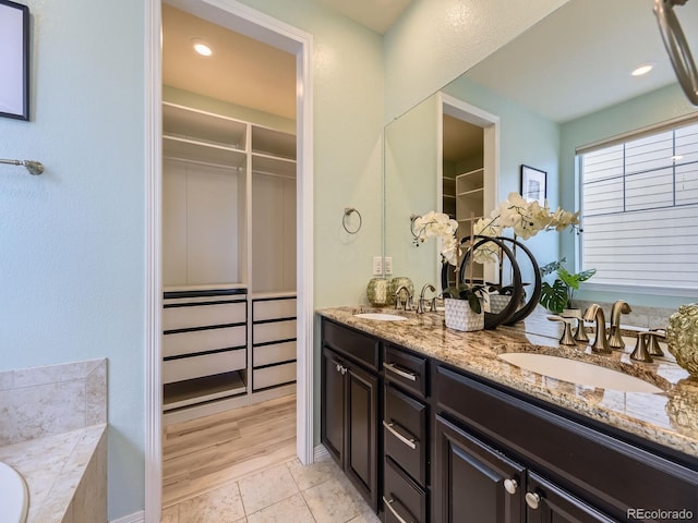 bathroom with hardwood / wood-style floors and vanity