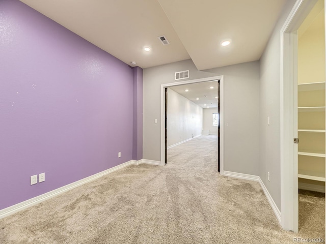 spare room with light colored carpet