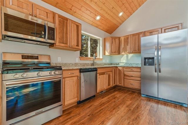 kitchen with stainless steel appliances, dark hardwood / wood-style flooring, wood ceiling, and light stone counters