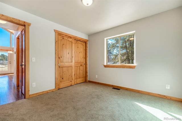 unfurnished bedroom featuring carpet flooring