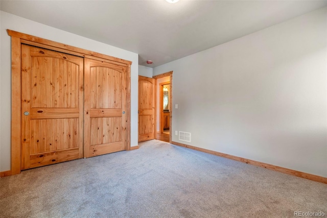 unfurnished bedroom with carpet floors