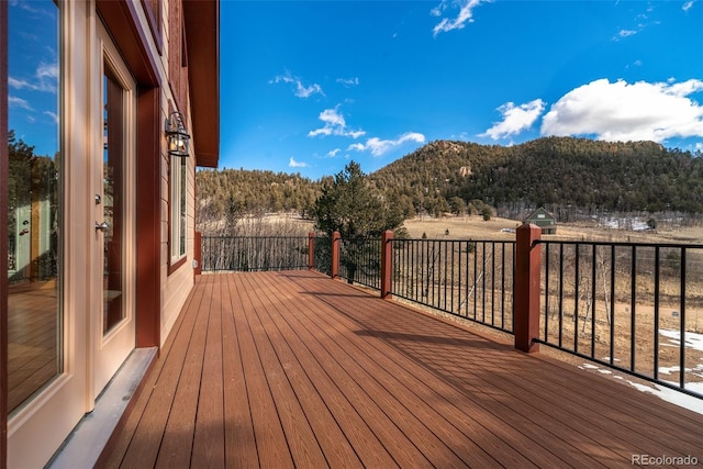 wooden terrace featuring a mountain view