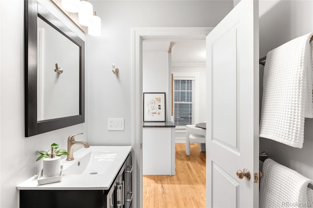 3425 W 34th Ave, Denver, CO 80211 - bathroom featuring vanity, wood finished floors, and crown molding