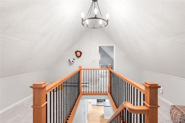 3425 W 34th Ave, Denver, CO 80211 - stairway featuring a chandelier, lofted ceiling, carpet floors, and baseboards