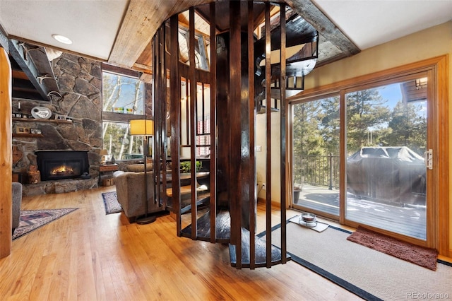 266 Lodgepole Dr, Evergreen, CO 80439 - interior space with a fireplace, wood finished floors, and beam ceiling