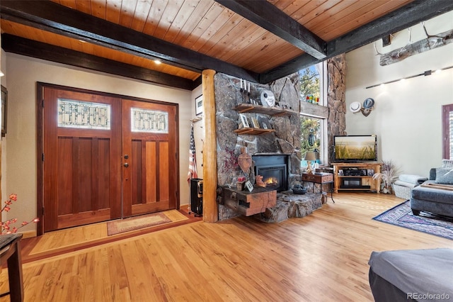 266 Lodgepole Dr, Evergreen, CO 80439 - entrance foyer featuring light wood finished floors, beamed ceiling, and wooden ceiling