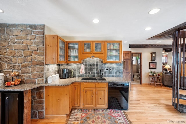 266 Lodgepole Dr, Evergreen, CO 80439 - kitchen featuring light wood finished floors, dishwasher, glass insert cabinets, light stone counters, and a sink