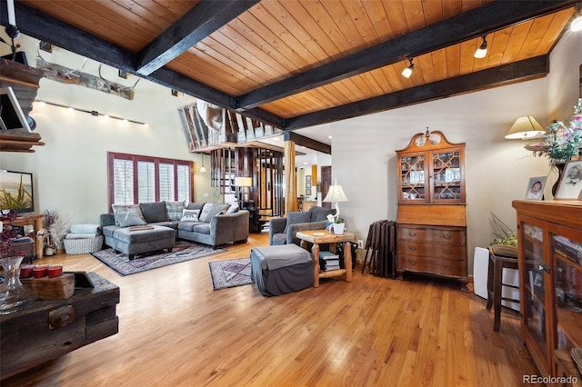 266 Lodgepole Dr, Evergreen, CO 80439 - living room featuring wood ceiling, light wood-style flooring, and beamed ceiling